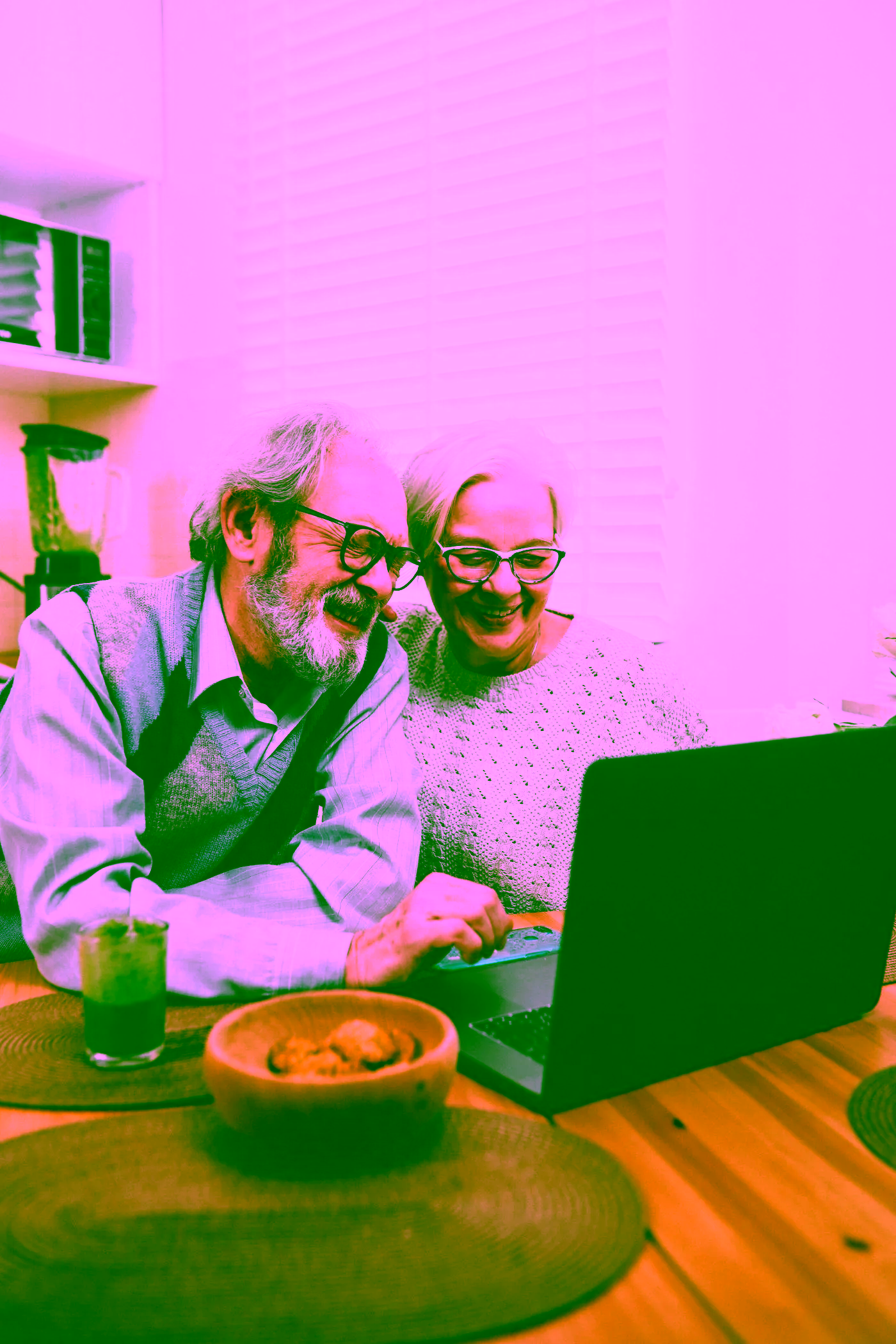 Couple looking through information on a laptop